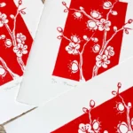 Plum blossom linocut print – botanical floral wall art by Grace Wong