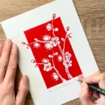 Plum blossom linocut print – botanical floral wall art by Grace Wong