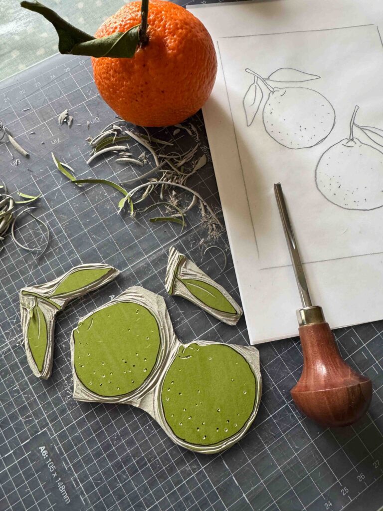 carving lino for a Mandarin themed linocut print